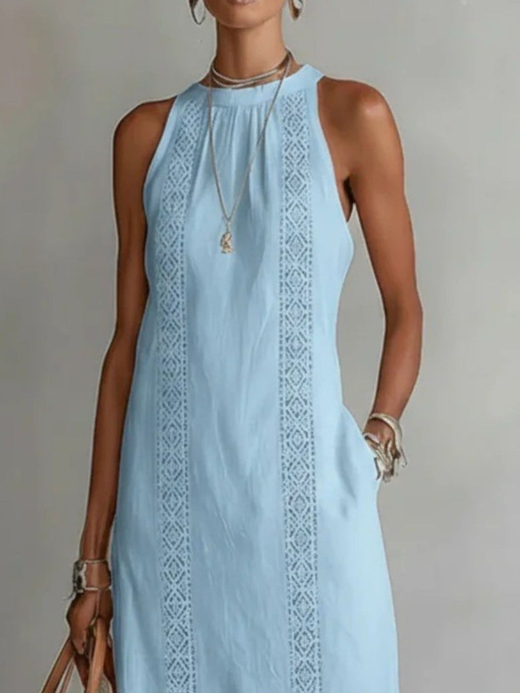 Light blue dress with intricate patterns on a neutral background